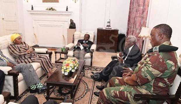 President Robert Mugabe (C) in a meeting with the ZDF Commander General Constantino Chiwenga, South African Minister of Defence Minister Nosiviwe Mapisa-Nqakula (in yellow head gear), Zimbabwe Defence Minister Dr Sydney Sekeramayi and Zimbabwe State Security Minister Cde Kembo Mohadi at State House in Harare, Zimbabwe.