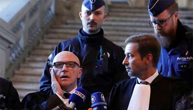 Paul Bekaert (left), the lawyer of sacked Catalan president Carles Puigdemont, speaks at a Belgian court as lawyer Christophe Marchand looks on, in Brussels on Friday.
