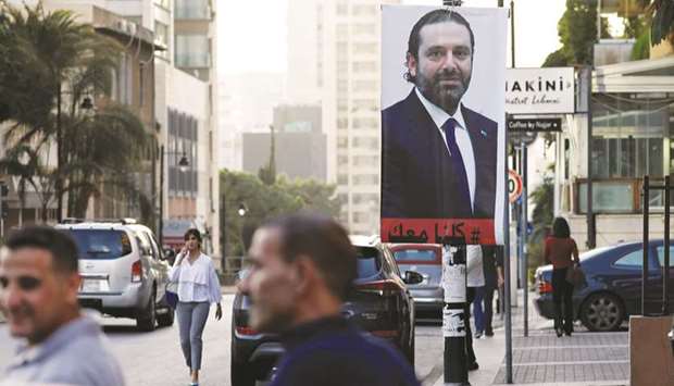 A poster depicting Saad Hariri, who announced his resignation as Lebanonu2019s prime minister from Saudi Arabia, is seen in Beirut, yesterday.
