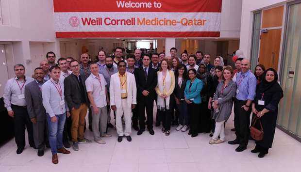 Some of the participants at the WCM-Q symposium pose for a group photo.