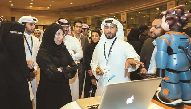 HE Dr Hanan Mohamed al-Kuwari visiting the Ooredoo stand with senior company executives.