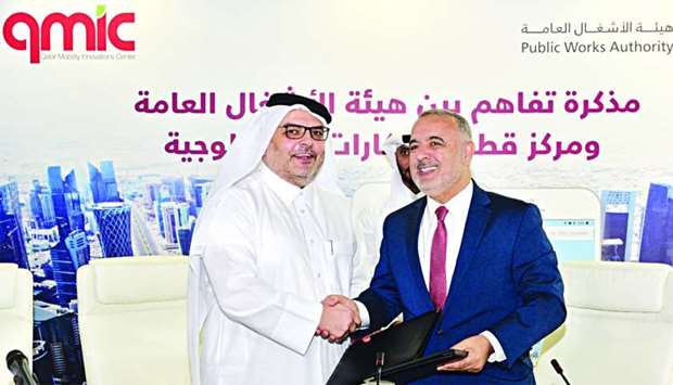 Ashghal president and senior engineer Saad bin Ahmed al-Muhannadi (left) and QMIC executive director Dr Adnan Abu Dayya at the MoU signing 