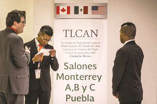 Security officers stand during the fifth round of Nafta renegotiations in Mexico City on Friday. The US wants reciprocal market access for manufactured goods as part of its push to improve its trade balance with Canada and Mexico, the office of the US Trade Representative said, updating its objectives for negotiating an agreement.