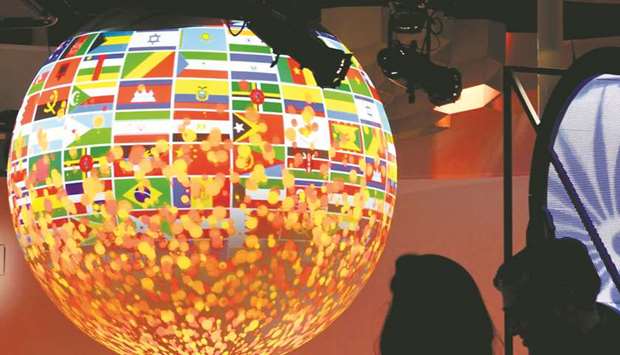 Visitors look at a sphere displayed at the pavilion of India during the COP23 United Nations Climate Change Conference in Bonn.