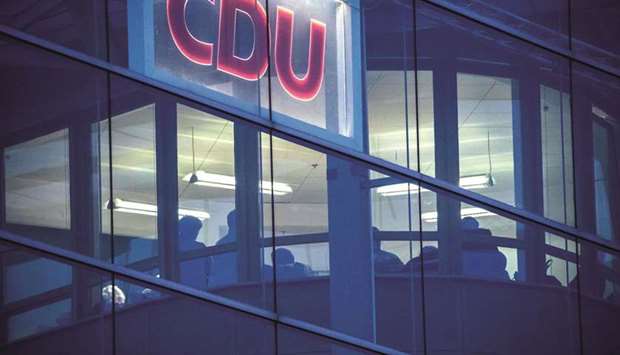 Negotiators from the four parties are seen at the CDU headquarters in Berlin late yesterday.