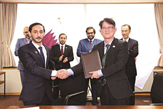 Head of Quarantine at Qataru2019s Ministry of Municipality and Environment Hussain Jibril al-Yahrri (left) and Norio Kumagai, director of Animal Health Division of the Japanu2019s Ministry of Agriculture, Forestry and Fishery (MAFF), Food Safety and Consumer Affairs Bureau pose after signing the agreement.