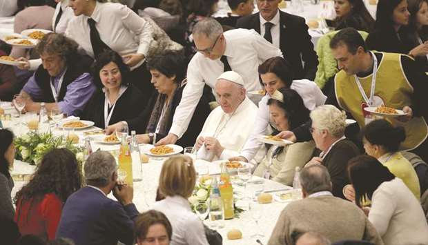 Pope Francis has lunch with the poor following a special mass to mark the new World Day of the Poor in the Paul VI Hall at the Vatican.
