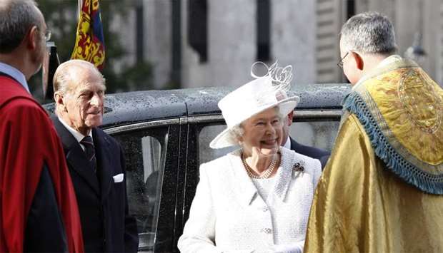 Britain's Queen Elizabeth II (2nd R) and Prince Philip (2nd L) arrive at Westminster Abbey in central London