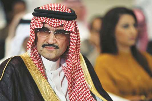 Saudi billionaire Prince Alwaleed bin Talal looks on during a news briefing (file). Kingdom Holdingu2019s plan to borrow money to fund new investments has stalled because owner Prince Alwaleed bin Talal has been detained in Saudi Arabiau2019s anti-corruption crackdown, according to four banking sources familiar with the matter.