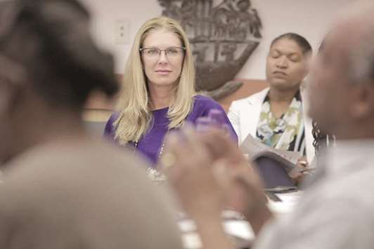 HOLDING FORTH: Michele King Soffer, centre, listens during a workshop at the Little Haiti Cultural Center with members of the Haitian community. Soffer is married to Donald Soffer, the developer of Aventura and the Turnberry Isle brand, and is of Haitian descent. She supports an orphanage in Haiti and is involved in the Ayiti Community Trust, which is seeking to raise $20 million for grassroots organisations in Haiti.