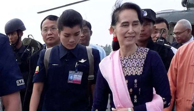Myanmar's de facto leader Aung San Suu Kyi arrives at Sittwe airport in the state of Rakhine