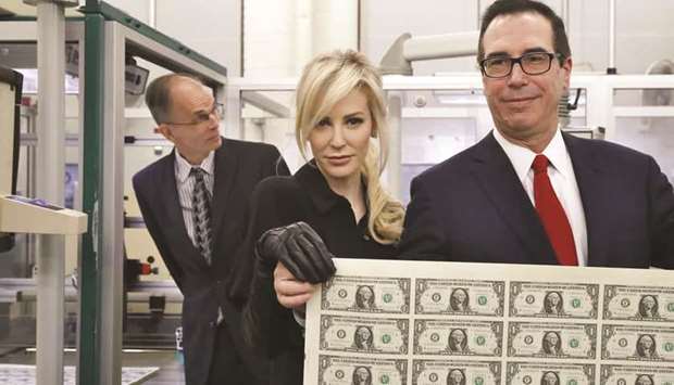 Linton and Mnuchin with freshly printed currency.