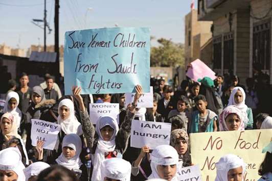 Children protest against the Saudi-led coalition outside the UN offices in Sanaa, Yemen yesterday.