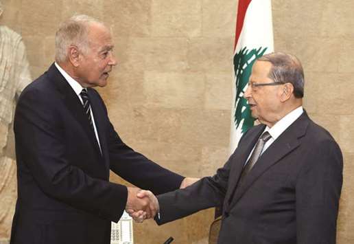 Lebanonu2019s President Michel Aoun shakes hands with Arab League Secretary-General Ahmed Aboul Gheit at the presidential palace in Baabda, yesterday.