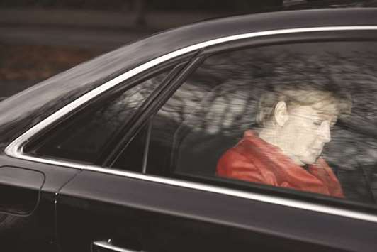 Merkel leaves in her car at the presidential residence Bellevue Castle in Berlin, where she met German President Steinmeier yesterday after coalition talks failed overnight.