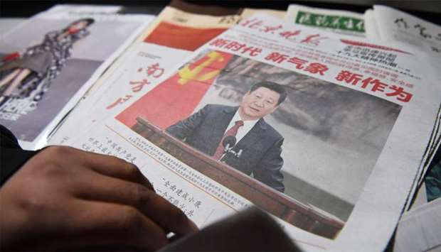 A newspaper featuring Chinese President Xi Jinping at a news stand