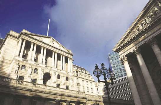 The Bank of England headquarters in London. Four BoE officials, part of the nine-member Monetary Policy Committee, told Parliament yesterday that it would be unwise to be too definite on borrowing costs.