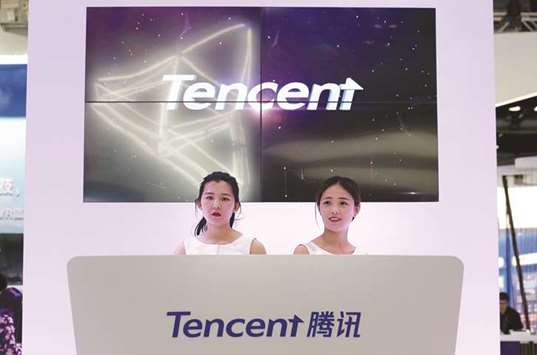 Tencentu2019s booth is seen at the Global Mobile Internet Conference (GMIC) 2017 in Beijing. By the end of the trading day yesterday, Tencentu2019s outstanding shares were worth a combined $523bn, surpassing Facebooku2019s $519bn.