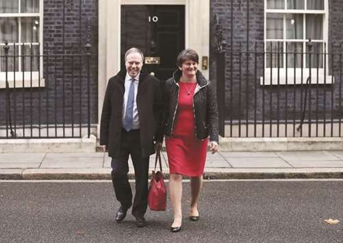 Arlene Foster, leader of the Democratic Unionist Party (DUP), and her deputy Nigel Dodds leave 10 Downing Street, London, yesterday.