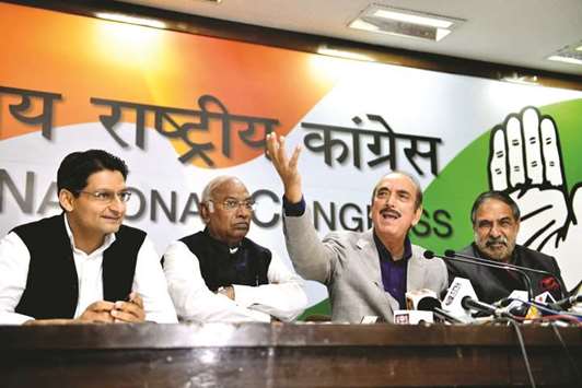 Congress leader Ghulam Nabi Azad speaks as Deepender Singh Hooda, Mallikarjun Kharge and Anand Sharma look on during a press a conference in New Delhi yesterday. The Congress slammed the government for delaying the winter session of parliament.