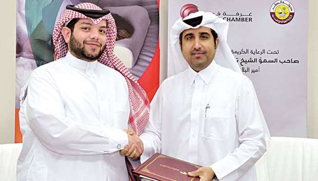 Qatar Chamber director-general Saleh bin Hamad al-Sharqi and Qatar Foam general manager Mohamed Ali Iskandar al-Ansari after signing the sponsorship agreement at the Chamberu2019s headquarters in Doha yesterday.