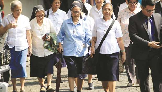 Nuns enter the Supreme Courtu2019s compound to attend the start of the oral arguments on the  consolidated petitions to declare President Duterteu2019s drugs war unconstitutional at the Supreme Court in Manila.