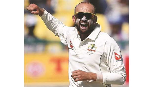 This file photo taken on March 26, 2017 shows Australiau2019s Nathan Lyon celebrating the wicket of Indiau2019s Cheteshwar Pujara during the second day of play of the fourth and last Test match at The Himachal Pradesh Cricket Association Stadium in Dharamsala. (AFP)