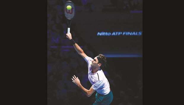 Switzerlandu2019s Roger Federer serves against Belgiumu2019s David Goffin during their menu2019s singles semi-final match on day seven of the ATP World Tour Finals tennis tournament at the O2 Arena in London on November 18.