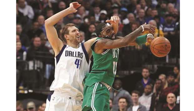 Dallas Mavericksu2019 Dirk Nowitzki (left) fouls Kyrie Irving of Boston Celtics during the NBA game at the  American Airlines Center in Dallas, Texas, on Monday. (AFP)