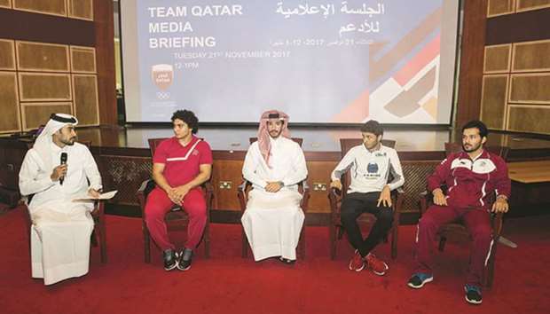 Weightlifter Fares Ibrahim (second from left), show jumping rider Khaled al-Emadi (centre), squash player Abdulla Tamimi and fencer Mohamed al-Shammeri (right) during a media briefing yesterday.
