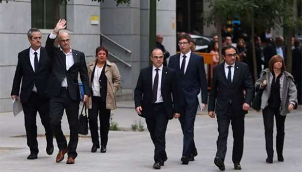 Dismissed Catalan cabinet members arrive at Spain's High Court after being summoned to testify, in Madrid on Thursday.