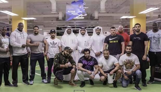 Qatar's Strongest Man 2017 competitors are seen with officials