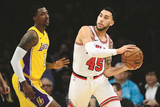 Chicago Bullsu2019 Denzel Valentine (right) controls the ball against Los Angeles Lakersu2019 Kentavious Caldwell-Pope during the second half of their NBA game at Staples Center in Los Angeles on Tuesday. (USA TODAY Sports)