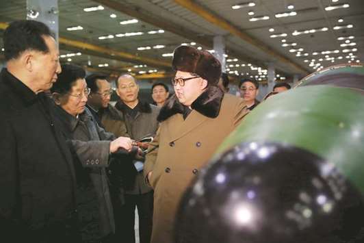 North Korean leader Kim Jong-un meets scientists and technicians in the field of researches into nuclear weapons in this undated photo.