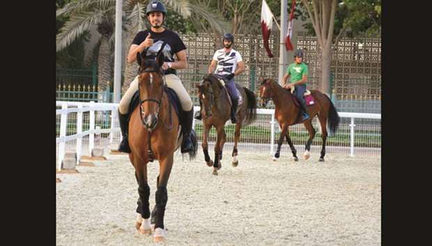 Riders train on the eve of the QNB Al Rayyan Show Jumping Championship, which kicks off today at the Qatar Equestrian Federationu2019s outdoor arena. PICTURE: Lotfi Garsi