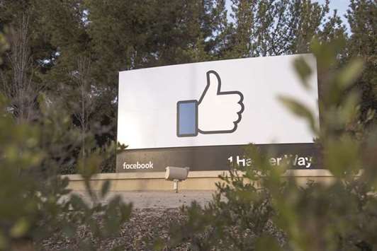 A signage is displayed outside Facebook headquarters in Menlo Park, California. This is Facebooku2019s most direct effort to explain to users how they may have been affected by the IRAu2019s postings, which reached an estimated 150mn people and stirred up controversy over gun rights, immigration, race relations and religion in the US.