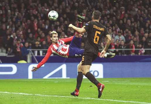 Atletico Madridu2019s Antoine Griezmann scores a spectacular goal against Roma in the Champions League. (Reuters)