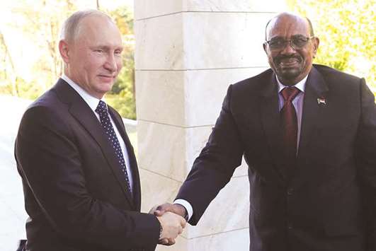 Russian President Vladimir Putin shakes hands with Sudanu2019s President Omar al-Bashir during their meeting in the Black Sea resort of Sochi.