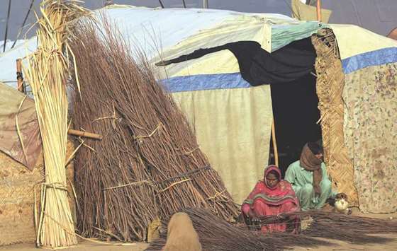 A labourer makes brooms outside her home in Lahore. A nationwide Jang Geo News Poll conducted last month in collaboration with Gallup Pakistan and Pulse Consultant has found that at least one in five Pakistanis believes unemployment and inflation are the biggest problems faced by the country.