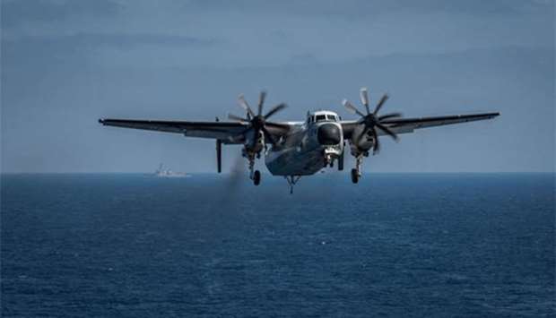 A C-2A Greyhound prepares to land on the flight deck aboard the aircraft carrier USS Theodore Roosevelt in the Pacific Ocean in this file picture.