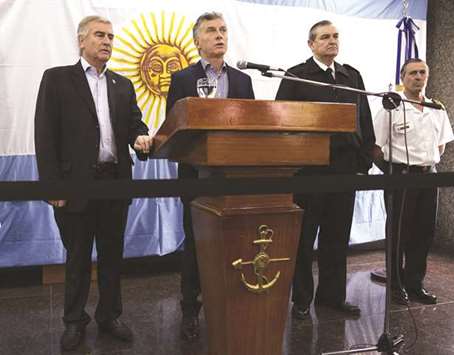 Argentine President Mauricio Macri speaks next to Defence Minister Oscar Aguad (left) and Vice admiral Marcelo Srur (second right) during a press conference yesterday. Marci demanded an inquiry to u201cknow the truthu201d about what happened to the missing submarine.