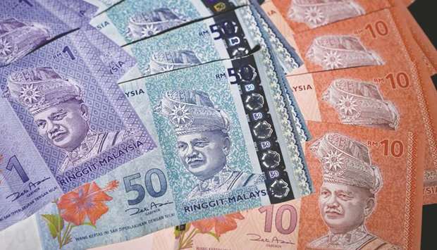 Investors taking a bet on the Malaysian ringgit need to first guess when Prime Minister Najib Razak will call a general election
