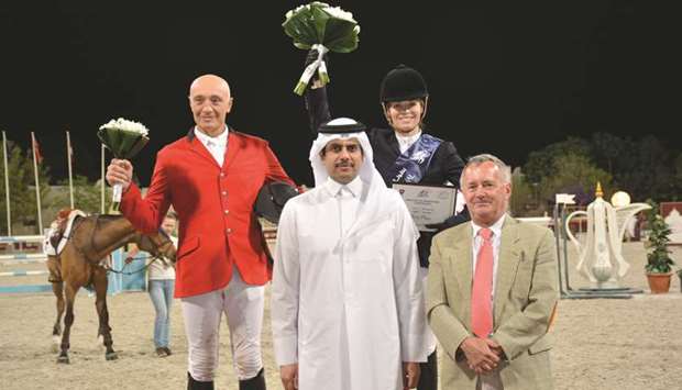 Winner Edwina Tops-Alexander (top right) and runner-up Vladimir Tuganov (left) pose with QEF president Hamad Abdulrahman al-Attiyah (front centre).