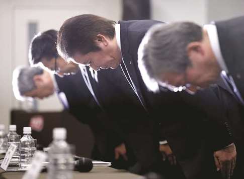 Mitsubishi Materials Corp president Akira Takeuchi (second right) bows with executive vice president Naoki Ono (second left), Mitsubishi Shindoh Co president Kazumasa Hori (left) and Mitsubishi Cable Industries president Hiroaki Murata during a news conference in Tokyo on Friday. The revelation is the latest in a series of scandals to dent the image of  Japanese manufacturers and echoes closely the admissions by Kobe Steel that it falsified data on the strength and durability of its products.