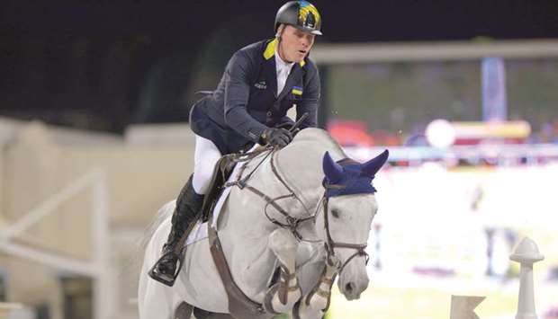 Ukraineu2019s Rene Tebbel rides 10-year-old stallion Cosun to Grand Prix title during the QNB Al Rayyan International Show Jumping Championship at the Qatar Equestrian Federationu2019s outdoor arena yesterday. PICTURES: Lotfi Garsi