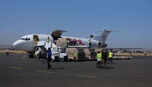 Workers unload aid shipment from a plane at the Sanaa airport, Yemen.  Reuters