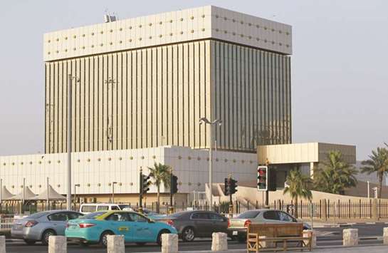 Cars drive past the Qatar Central Bank building in Doha (file). The QCB is coordinating regularly with all banks and financial institutions to follow up banking operations and ensure the processing of all transactions as normal.