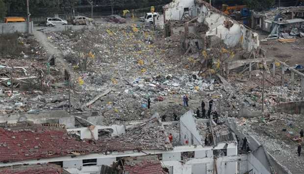 Rescue workers work at the site of a blast in Ningbo