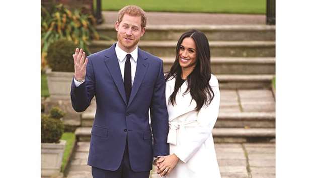 Prince Harry poses with Meghan Markle in the Sunken Garden of Kensington Palace, London, yesterday.