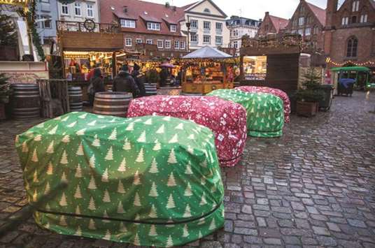 Concrete barriers decorated as presents can be seen at the entrance of the Christmas market in Luebeck, northern Germany.